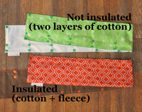 Shows a green wide cord keeper that's not insulated and made from two layers of cotton, then an orange print wide cord keeper that is insulated, made from one layer of cotton and one layer of fleece.